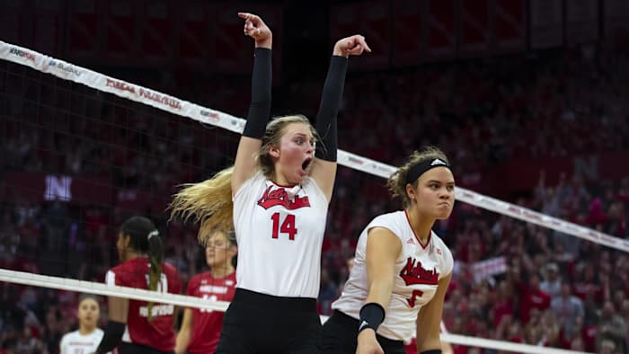 Ally Batenhorst (14) and Bekka Allick (15) celebrate a point against Wisconsin. (Nov. 25, 2022)